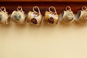 beverage, breakfast, ceramic, coffee, crockery, tea cup, cup, dish, handle, kitchen, coffee cup, mug, object, pottery, row, tea, decorated, cups, mugs, brown, brown coffee, brown kitchen, brown tea, brown cup, brown breakfast